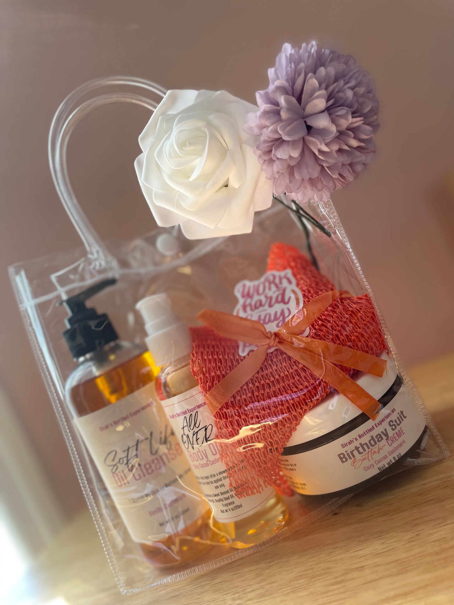 Gift set with skincare products in a gift bag on a wooden surface