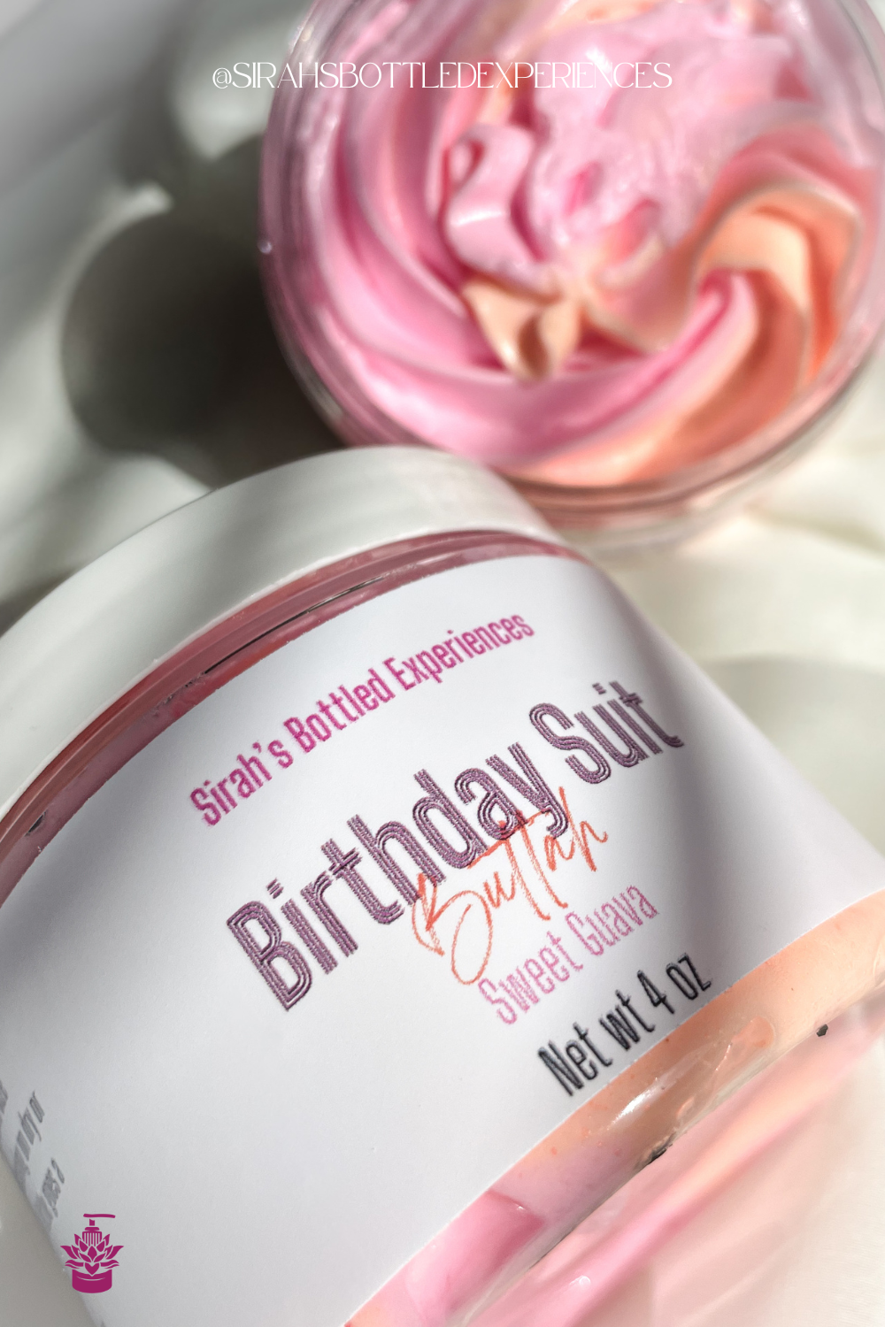 Jar of 'Birthday Suit' butter with white label on a white cloth