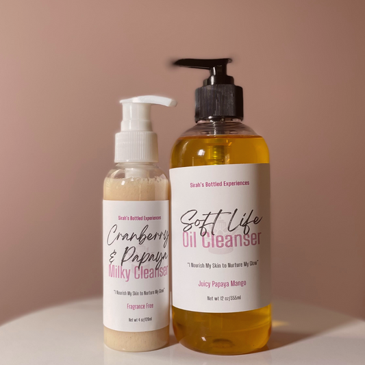 Two skincare products, a Milky Cleanser and an Oil Cleanser, on a beige background.